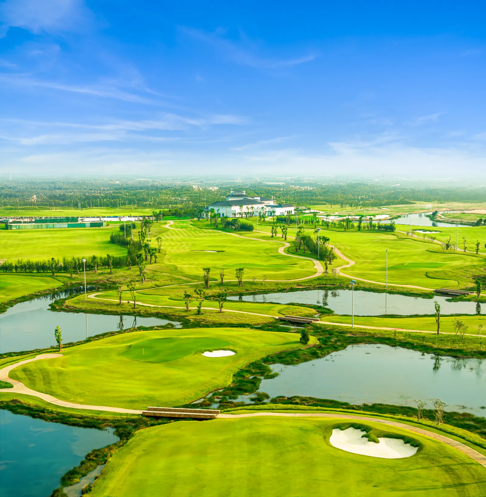 Expansive white sand bunkers and water hazards at Vinpearl Golf Leman Cu Chi